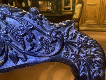 An Anglo-Indian colonial carved wooden sofa with two matching chairs, late 19th C.