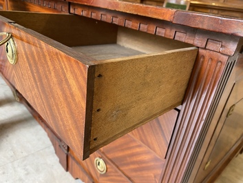 An English neoclassical leather-topped mahogany library desk with gilt bronze mounts, 19th C.