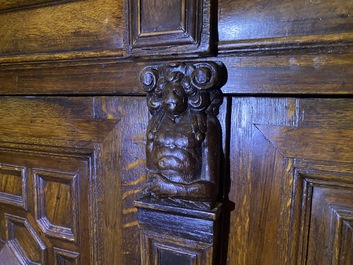 A Flemish ebonised and oak wooden four-door cabinet, 17th C.