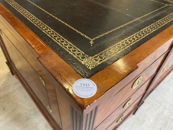 An English neoclassical leather-topped mahogany library desk with gilt bronze mounts, 19th C.