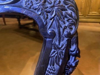 An Anglo-Indian colonial carved wooden sofa with two matching chairs, late 19th C.