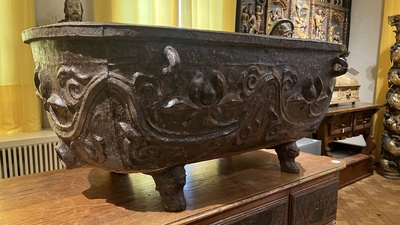A large Chinese cast iron jardini&egrave;re on four lion feet, 19th C.
