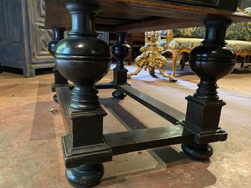 A rare ebonised wooden baluster leg table with polychromed reliefs, 17th C. with later elements