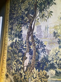 A French Aubusson wall tapestry with a wolf battling a fox in a forest setting with castle view, 19th C.