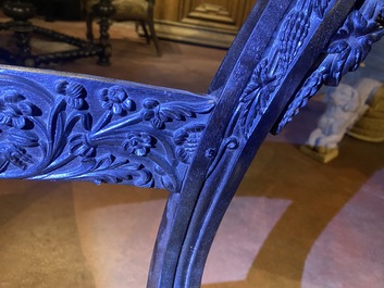 An Anglo-Indian colonial carved wooden sofa with two matching chairs, late 19th C.