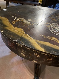 A black lacquered table with polychrome chinoiserie design and mother-of-pearl inlay, ca. 1900