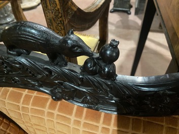 An Anglo-Indian colonial carved wooden sofa with two matching chairs, late 19th C.