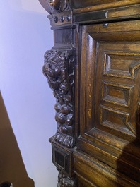 A Flemish ebonised and oak wooden four-door cabinet, 17th C.