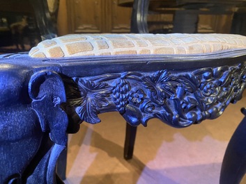 An Anglo-Indian colonial carved wooden sofa with two matching chairs, late 19th C.