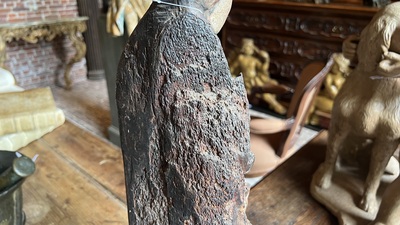 A Flemish carved and polychromed oak figure of a bishop on an armorial base, ca. 1500