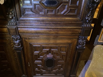 A Flemish ebonised and oak wooden four-door cabinet, 17th C.