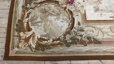 A large French Aubusson rug with floral design and landscapes, 19th C.