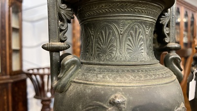 A pair of neoclassical style vases with charioteers on a Siena marble base, 19/20th C.