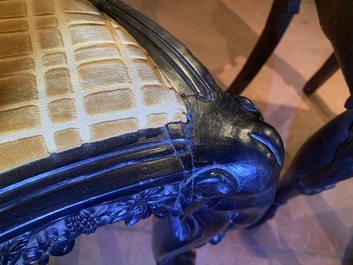 An Anglo-Indian colonial carved wooden sofa with two matching chairs, late 19th C.