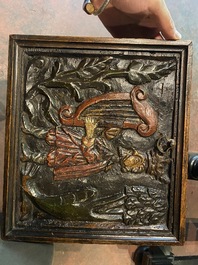 A rare ebonised wooden baluster leg table with polychromed reliefs, 17th C. with later elements