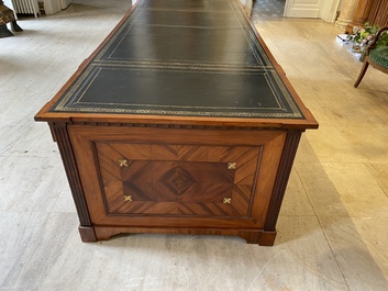 An English neoclassical leather-topped mahogany library desk with gilt bronze mounts, 19th C.