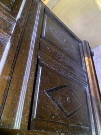 A Flemish ebonised and oak wooden four-door cabinet, 17th C.