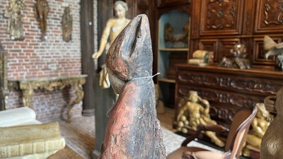 A Flemish carved and polychromed oak figure of a bishop on an armorial base, ca. 1500