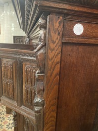 A rare German carved oak sculptural cupboard on diagonal supports with recumbent lions, Westphalia, 16th C.