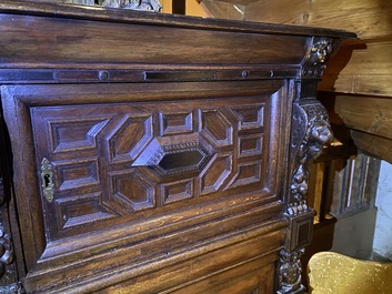 A Flemish ebonised and oak wooden four-door cabinet, 17th C.