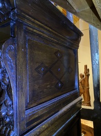 A Flemish ebonised and oak wooden four-door cabinet, 17th C.