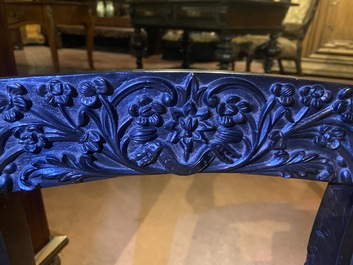 An Anglo-Indian colonial carved wooden sofa with two matching chairs, late 19th C.