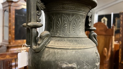 A pair of neoclassical style vases with charioteers on a Siena marble base, 19/20th C.