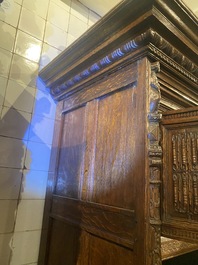 A rare German carved oak sculptural cupboard on diagonal supports with recumbent lions, Westphalia, 16th C.