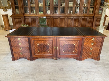 An English neoclassical leather-topped mahogany library desk with gilt bronze mounts, 19th C.