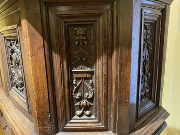 A walnut 'credence' case with portrait medallions, probably France, late 17th C. with later elements