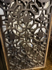 A pair of Chinese openworked and gilt wooden panels with floral design, 19/20th C