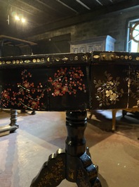 A black lacquered table with polychrome chinoiserie design and mother-of-pearl inlay, ca. 1900