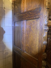 A rare German carved oak sculptural cupboard on diagonal supports with recumbent lions, Westphalia, 16th C.