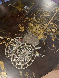 A black lacquered table with polychrome chinoiserie design and mother-of-pearl inlay, ca. 1900