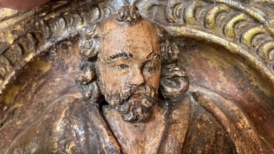 A Spanish polychrome and gilt wooden alto relievo depicting Saint Peter under an arcade, 17th C.