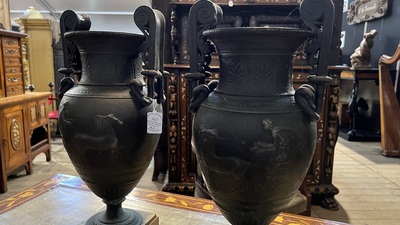 A pair of neoclassical style vases with charioteers on a Siena marble base, 19/20th C.