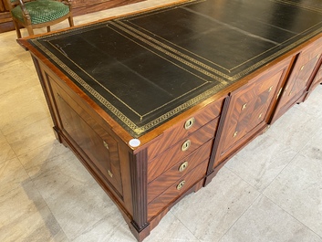 An English neoclassical leather-topped mahogany library desk with gilt bronze mounts, 19th C.