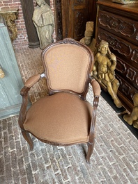 A French wooden armchair with curved back, 18th C.