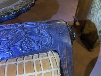 An Anglo-Indian colonial carved wooden sofa with two matching chairs, late 19th C.