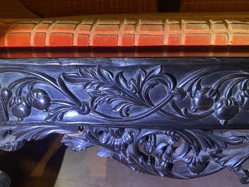 An Anglo-Indian colonial carved wooden sofa with two matching chairs, late 19th C.