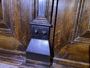 A Flemish ebonised and oak wooden four-door cabinet, 17th C.