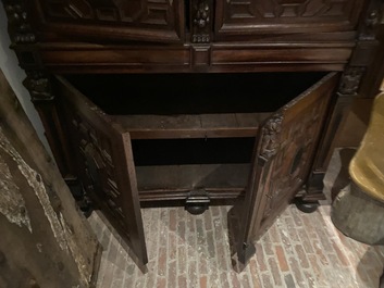 A Flemish ebonised and oak wooden four-door cabinet, 17th C.