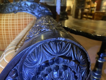 An Anglo-Indian colonial carved wooden sofa with two matching chairs, late 19th C.