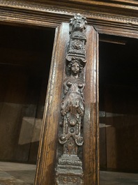 A Flemish ebonised and oak wooden four-door cabinet, 17th C.