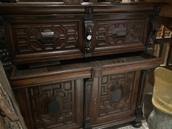 A Flemish ebonised and oak wooden four-door cabinet, 17th C.