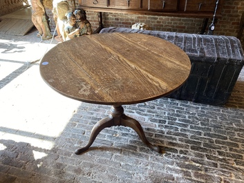 An English oak folding table, 19th C.