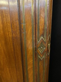 A Russian Directoire gilt brass-mounted wooden corner cupboard, early 19th C.