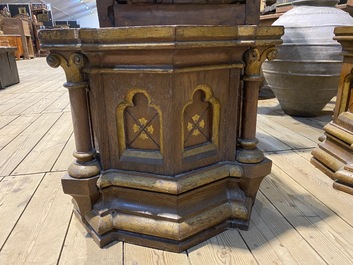 A pair of partly gilt wooden Gothic Revival stands, 19th C.