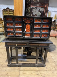 An ebonised wooden cabinet with faux-tortoiseshell veneer, 19th C.