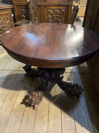 An Anglo-Indian colonial table on a well-carved stand with lions and peacocks, 19th C.